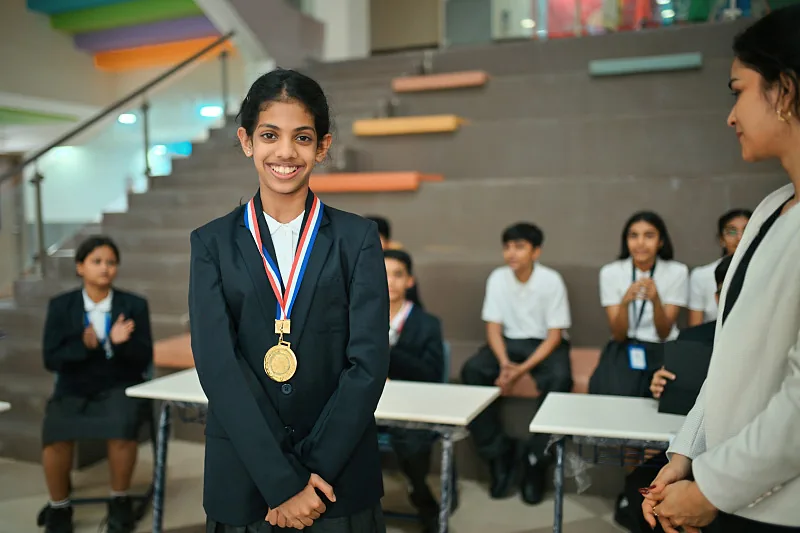 Student receiving a medal during a school recognition ceremony