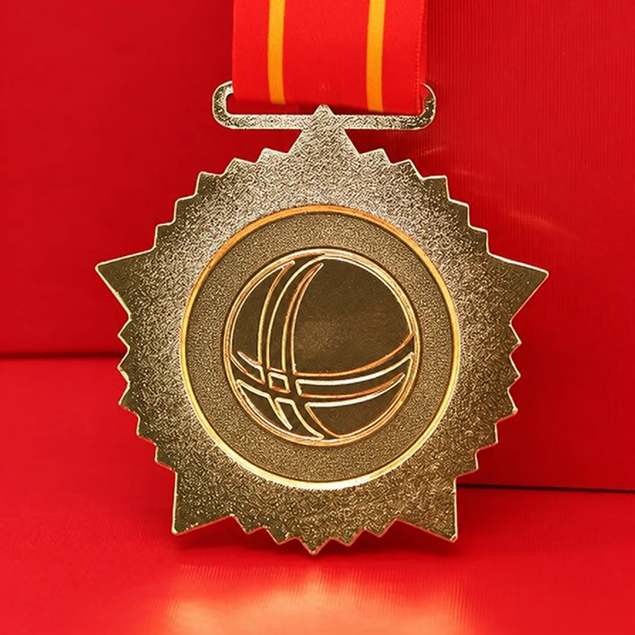 Privacy-edited reverse view of the same gold star-shaped medal