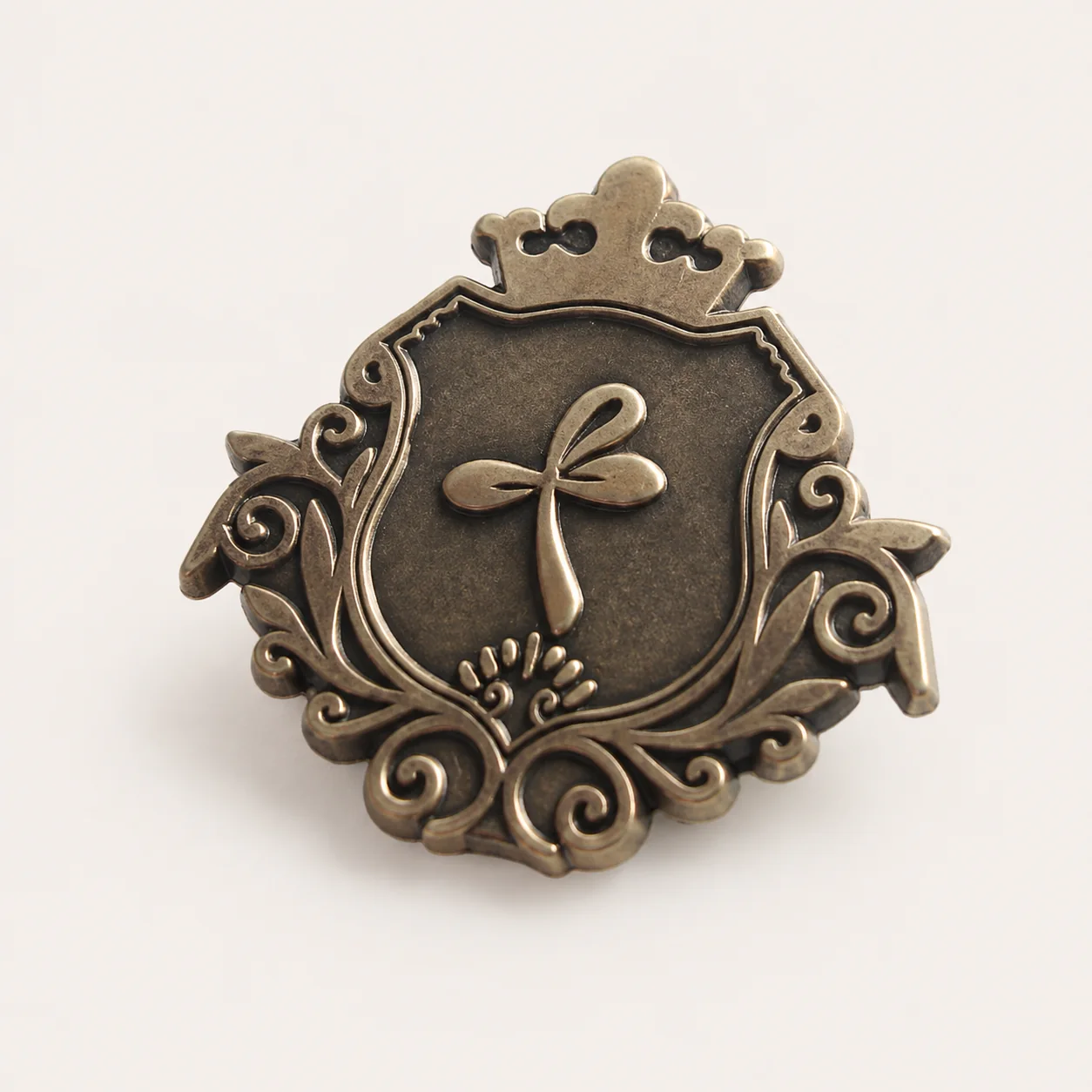 Antique gold plated metal badge