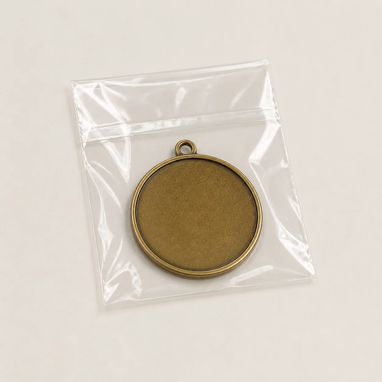 Antique gold medal individually packed in a clear self-seal OPP bag
