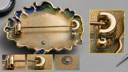 Reverse of a brooch with a horizontal pin mechanism and enlarged attachment details