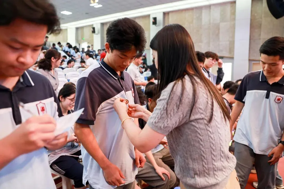 Student wearing a medal during a school award ceremony